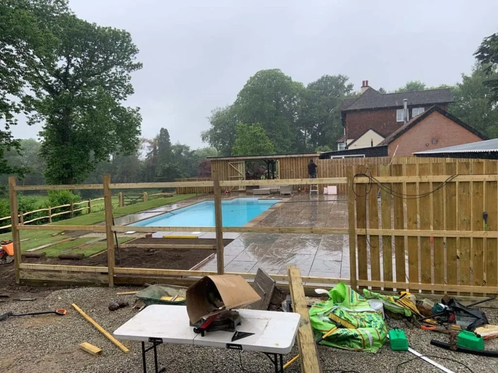 This is a photo of Bespoke custom fencing installed around a swimming pool by Fast Fix Fencing Tonbridge