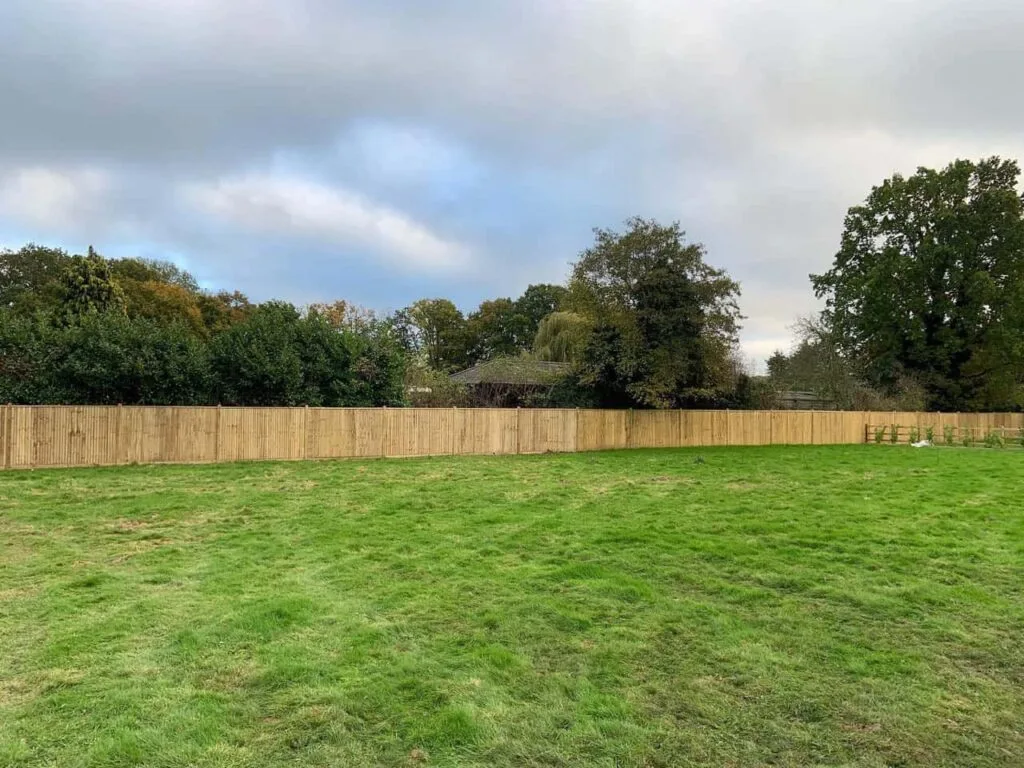 This is a photo of feather edge fencing installed around the edge of a field by Fast Fix Fencing Tonbridge