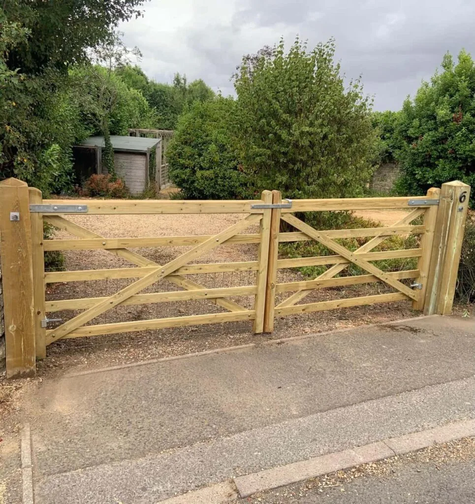 This is a photo of a wooden driveway gate installed by Fast Fix Fencing Tonbridge